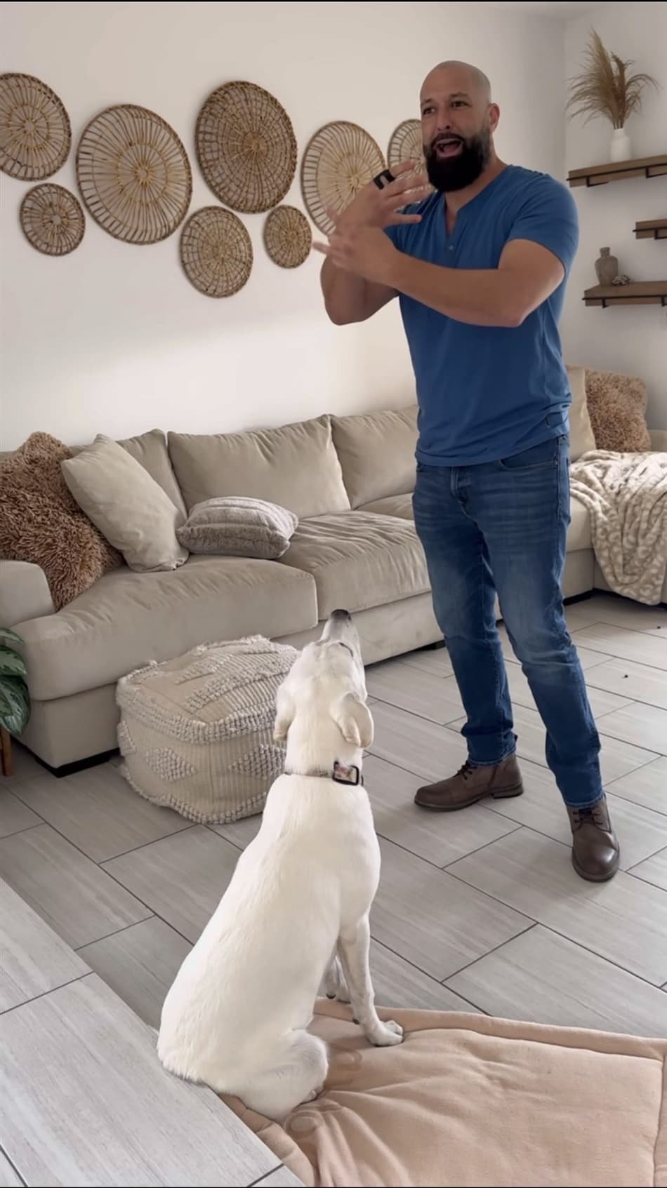 Uncle Jess using hand signals with a client's dog during an in-home training session
