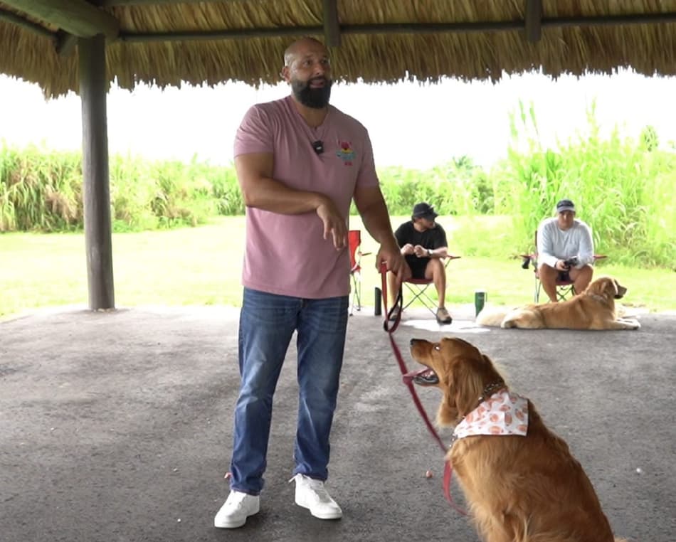 Uncle Jess teaching a group training class with owners and their dogs